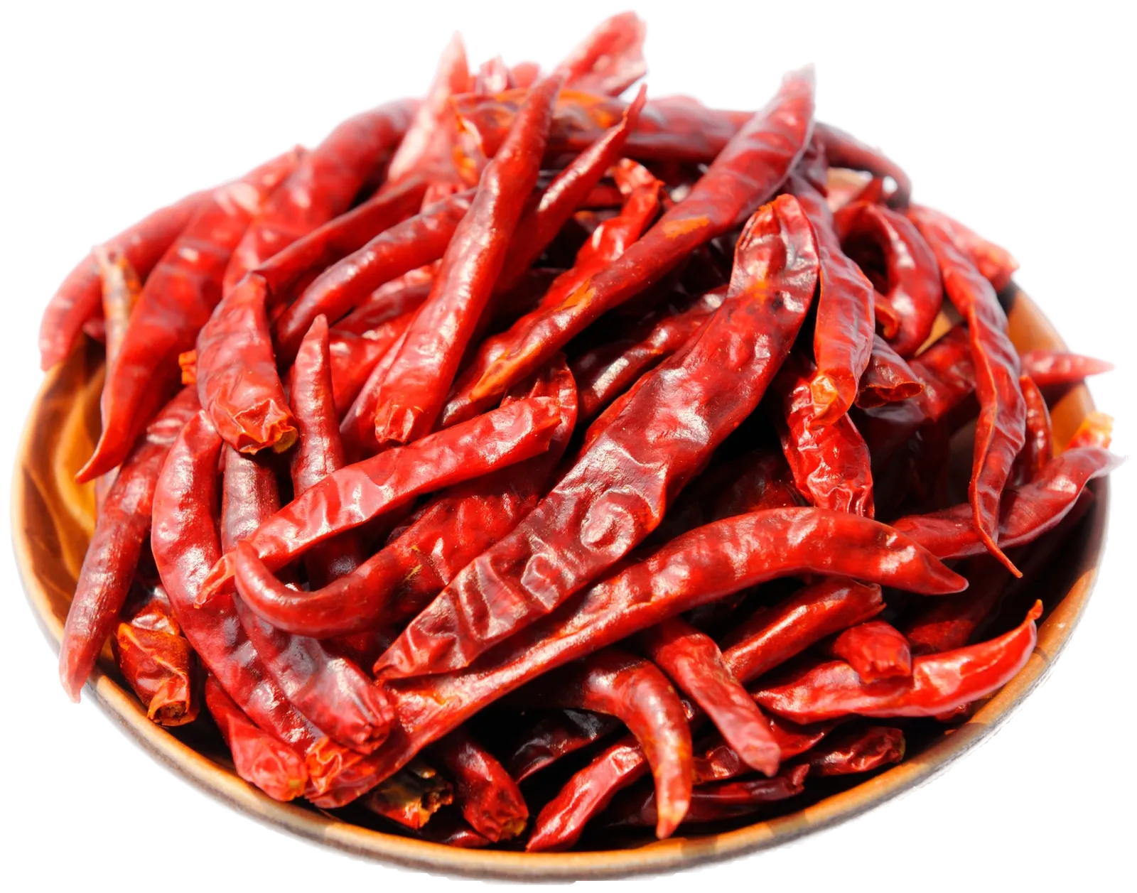 A wooden plate heaped with dried red chillies